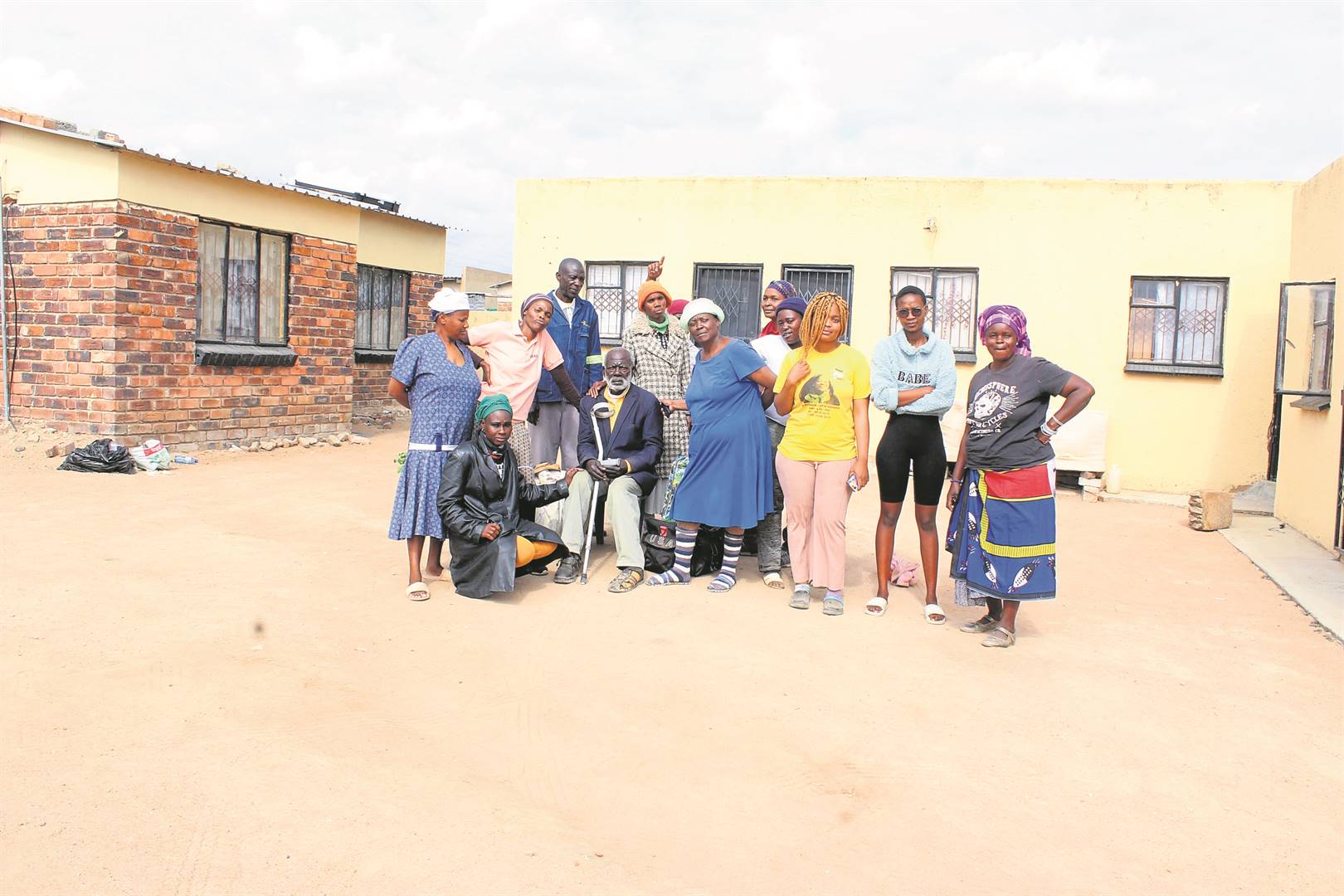Mkhulu Emmanuel Sithole (seated) said he had an agreement with the house owner that he could live in the property for free.                    Photo by Judas Sekwela