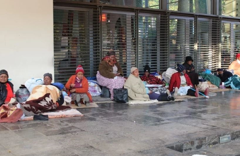 About 90 pensioners sleeping outside the Constitutional Court in Johannesburg in May. They are demanding to be paid reparations for human rights violations under apartheid.