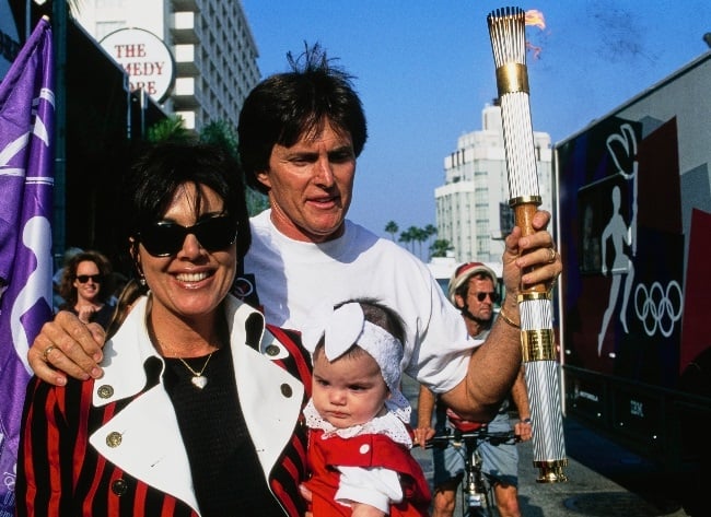 Caitlyn, then Bruce Jenner, holds the Olympic Torc