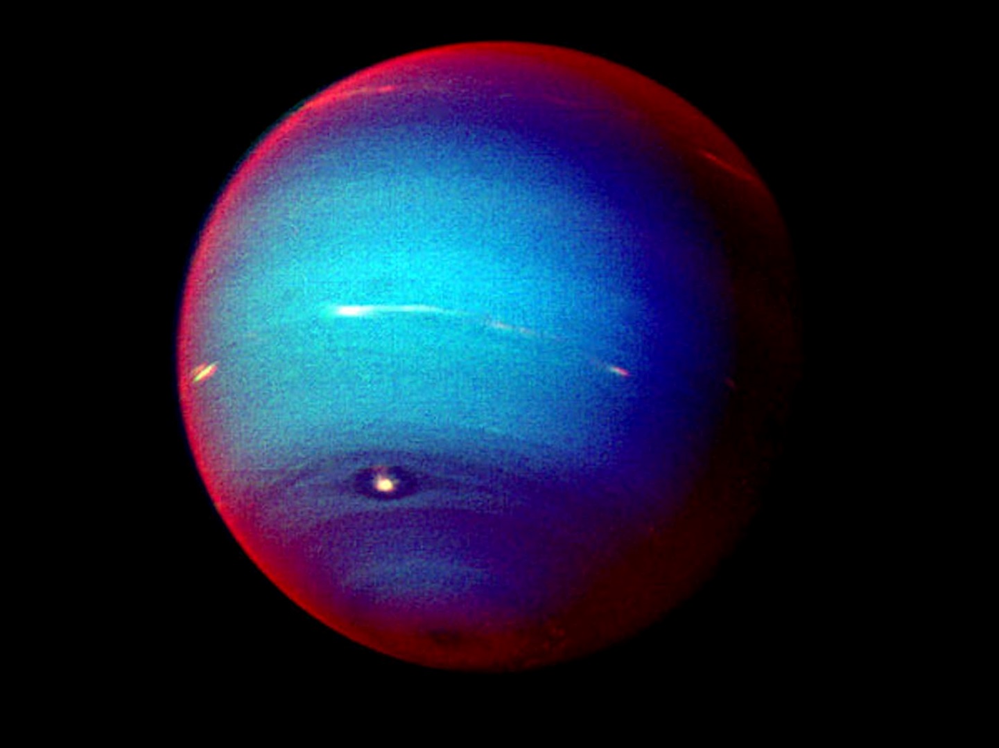 Neptune, seen in false color by Voyager 2 in 1989. Here's the red or white colour means that the sunlight is going through a methane-rich atmosphere. NASA/JPL