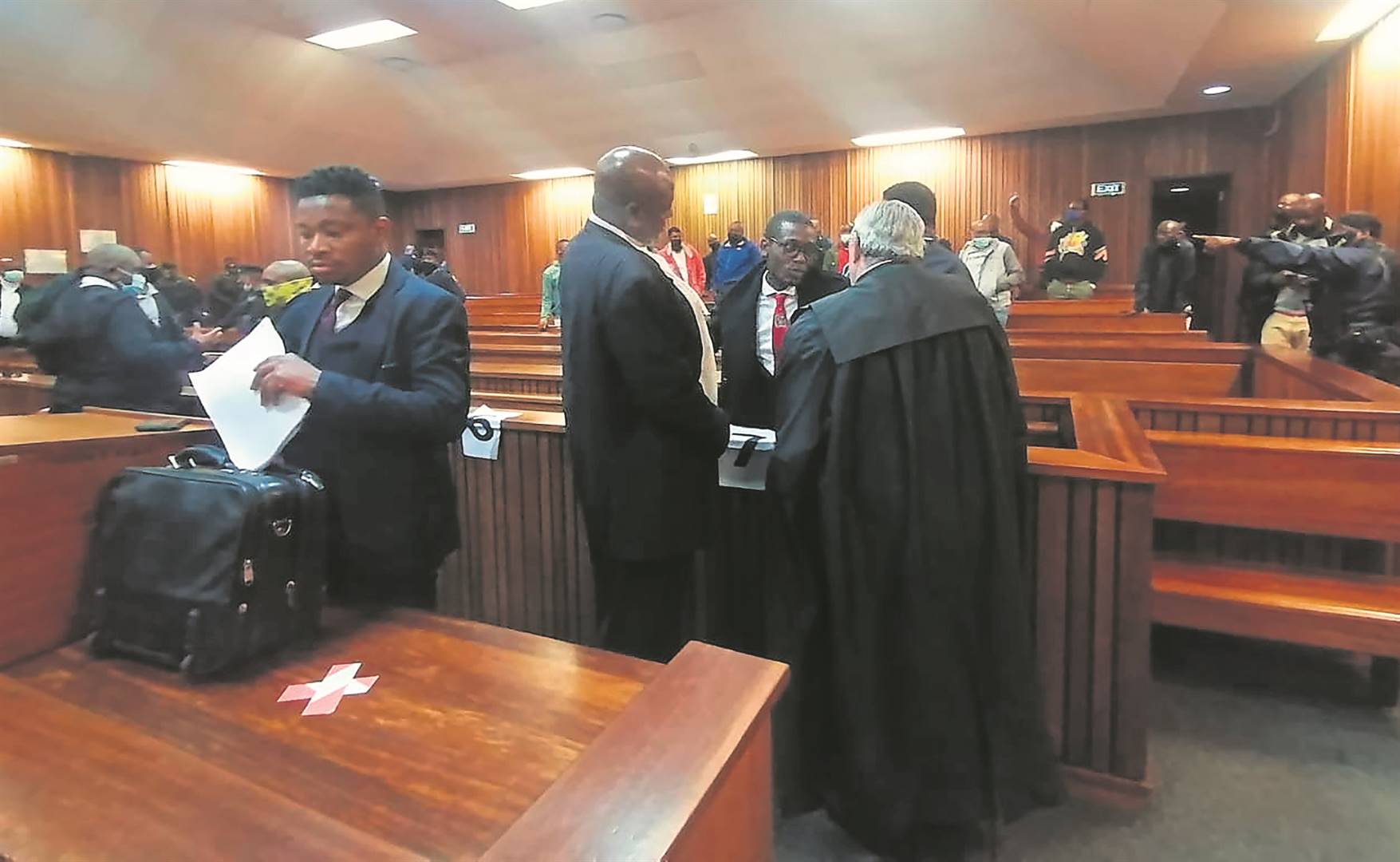 Murder-accused Vusi Mathibela (red tie), along with his co-accused, will hear judgment on their case on today. Photo by Aaron Dube