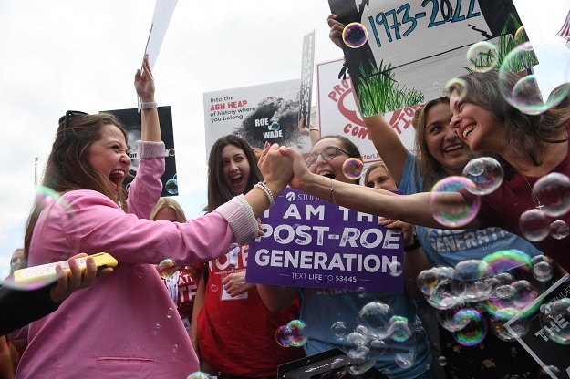 Anti-abortion activists celebrate outside the United States