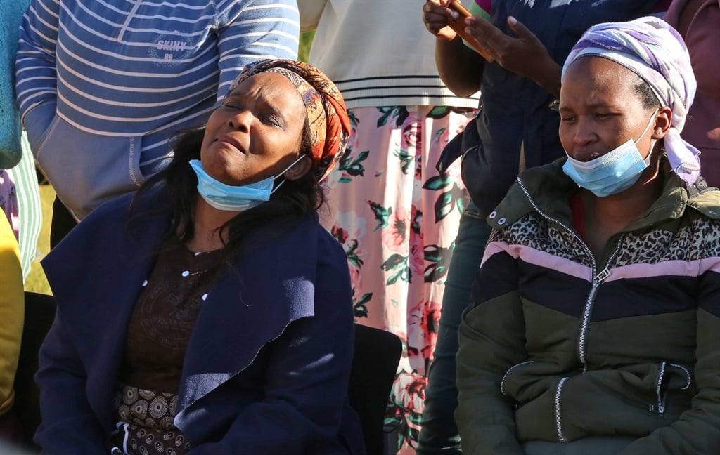 Grieving families of 21 children who died at an East London tavern. 