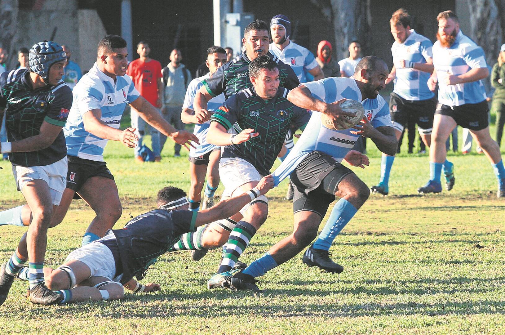 Cheslyn Roberts of Union-Milnerton cuts through the defence of SK Walmers with Muhammed Burns trying to stop his leg drive during a Western Province Rugby Union Super League A game played in Green Point on Saturday 25 June. Kloof is yet record a win for the season, with Uni-Mil forcing them deeper into the quagmire with a 33-3 drubbing.PHOTO: Rashied Isaacs