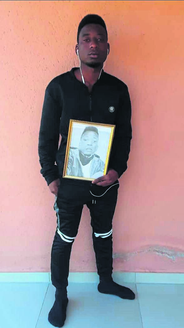 Banele Dlamini, a young artist from Mpumalanga, shows off his pencil drawing of himself.      Photos By Oris Mnisi