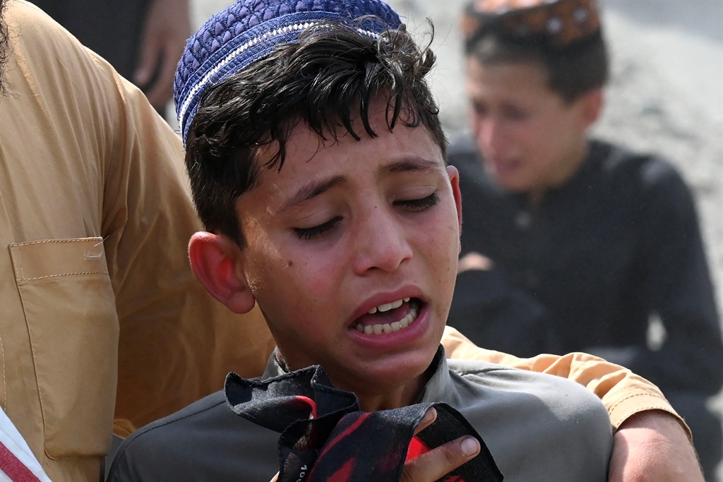 A boy weeps the death of his family member, a day 