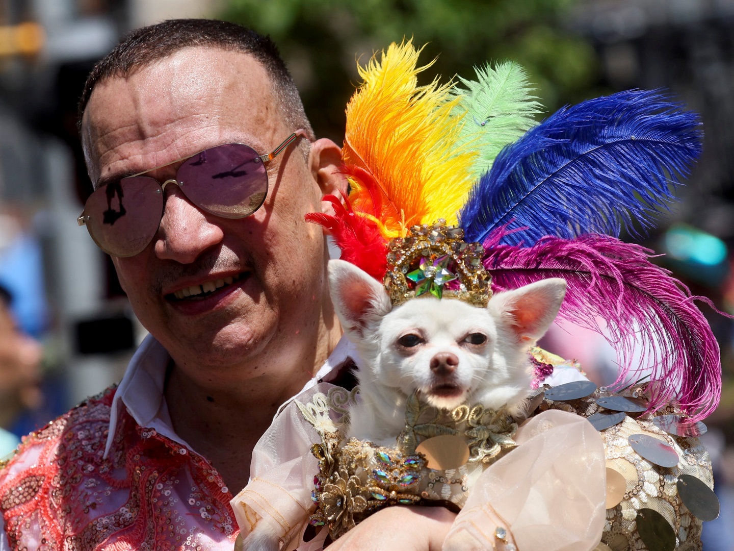 A person holds a dog at the 2022 NYC Pride parade, in New York City, on June 26, 2022. Brendan McDermid/Reuters
