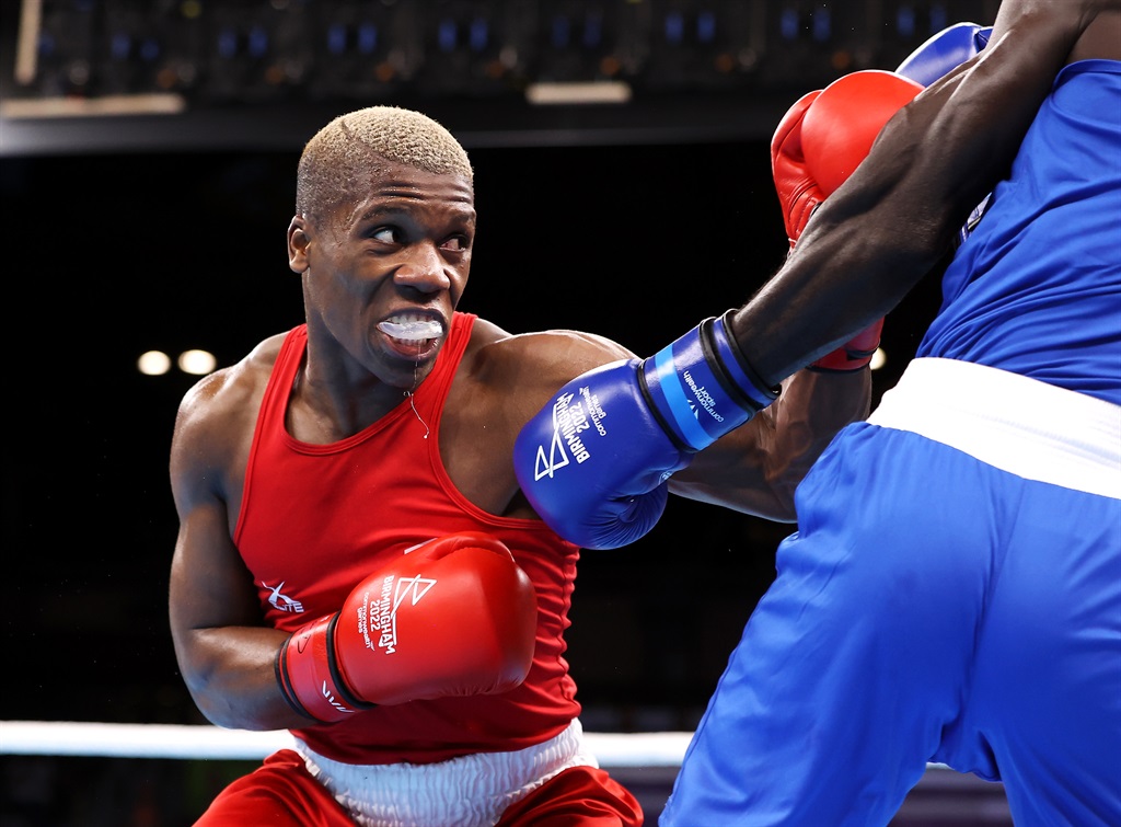 Simnikiwe Bongco (red) of Team South Africa punches Foday Badjie of Team Gambia in the menâ??s Over 71kg-75kg (Middleweight) round 16 bout of the boxing on day three of the Birmingham 2022 Commonwealth Games at NEC Arena on July 31, 2022 on the Birmingham, England. (Photo by Mark Kolbe/Getty Images)
