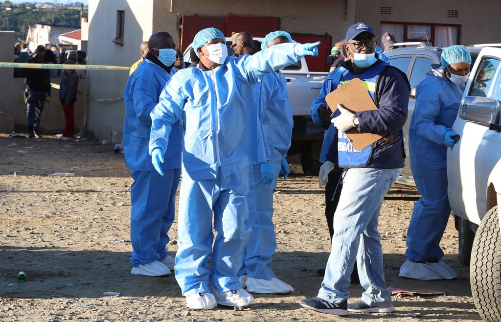 Forensic experts at the scene where 21 children died at Enyobeni Tavern in East London.