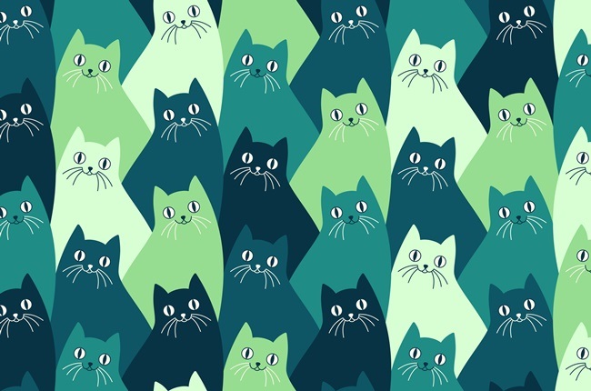 Seamlessly repeating kitty cat pattern with happy cats with whiskers.