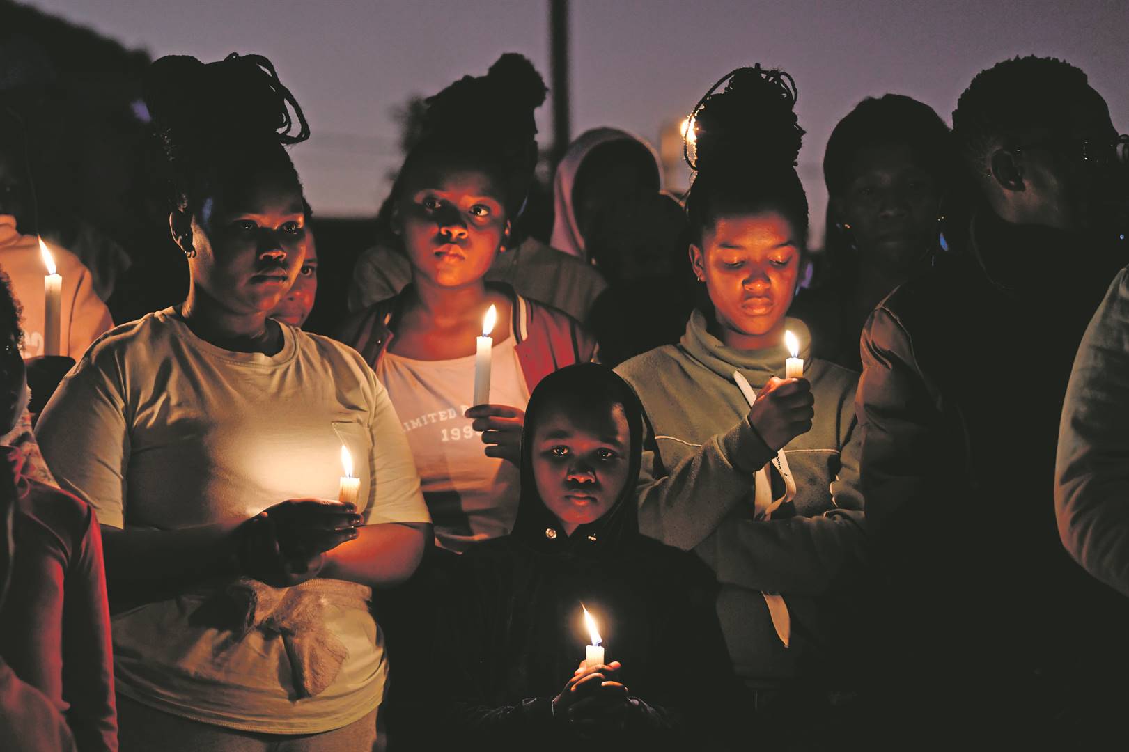  A candle prayer service was held at the scene in East London where 21 children died last week Photo: Lulama Zenzile