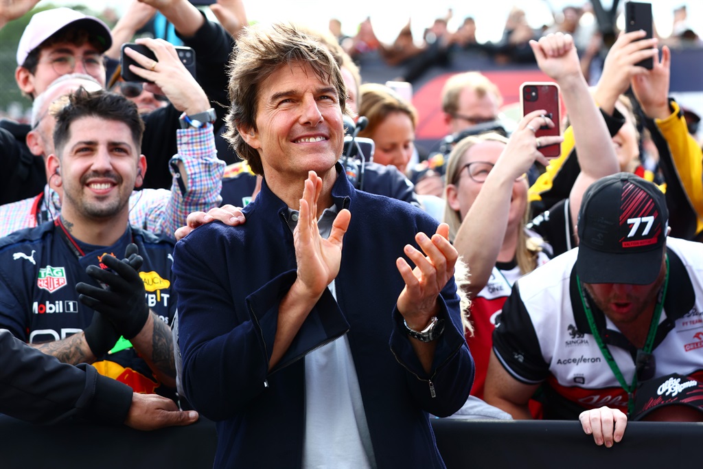 Tom Cruise applauds at the Podium celebrations dur