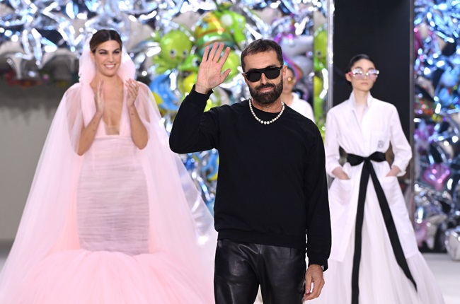 Bianca Brandolini d'Adda (L) and designer Giambattista Valli walk the runway during the Giambattista Valli Haute Couture Fall Winter 2022 2023 show as part of Paris Fashion Week on July 04, 2022 in Paris, France.