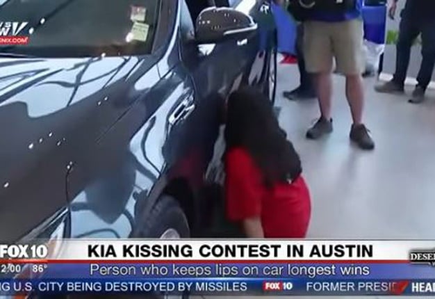 <b>KISSED A KIA FOR 50 HOURS:</b> Dilini Jayasuriya, the winner of a 2017 Kia Optima, after 'smooching' the sedan for just over two days. <i>Image: Youtube</i> 