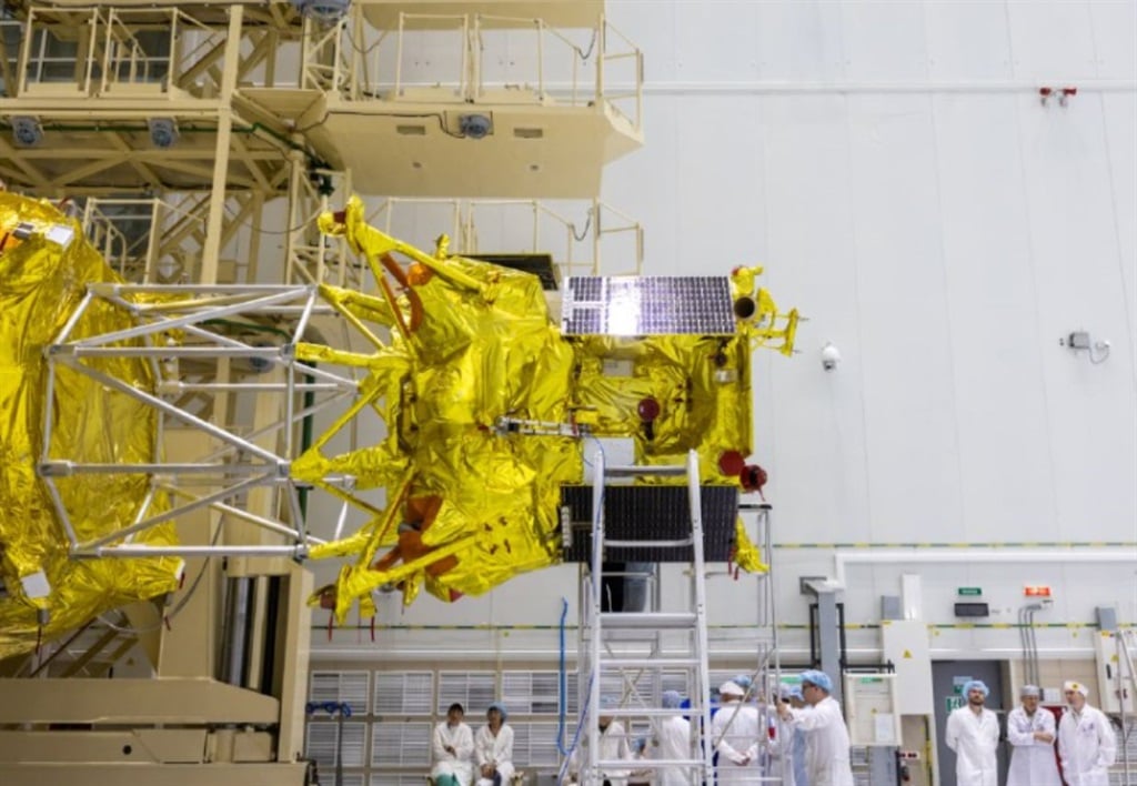 Luna-25 being fixed to the rocket that will propel it to the moon.