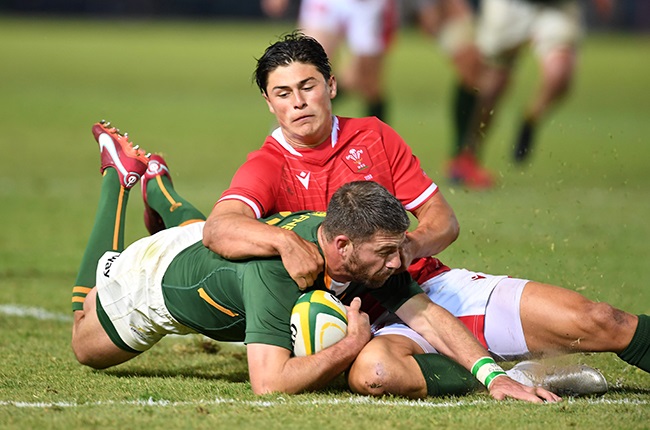 Louis Rees-Zammit tackles Willie le Roux. (Photo by Lefty Shivambu/Gallo Images)