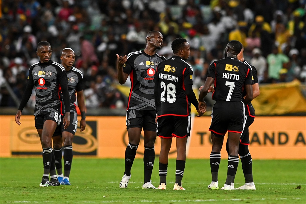 DURBAN, SOUTH AFRICA - OCTOBER 07: Tapelo Xoki, captain of Orlando Pirates with team at half time during the MTN8 final match between Orlando Pirates and Mamelodi Sundowns at Moses Mabhida Stadium on October 07, 2023 in Durban, South Africa. (Photo by Darren Stewart/Gallo Images)
