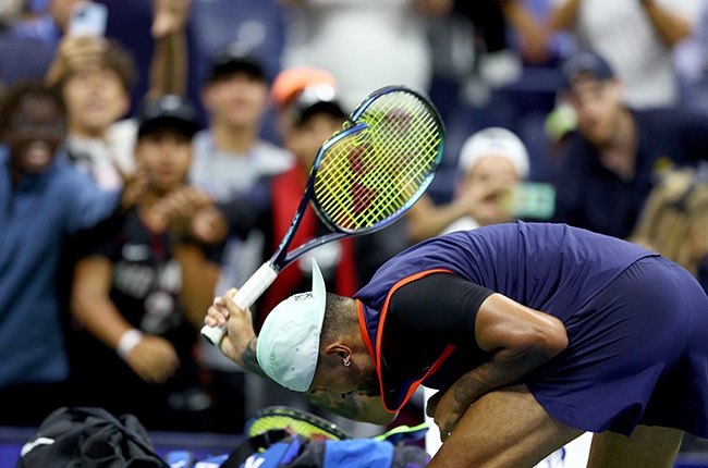 Nick Kyrgios smashes his racquet after losing to Karen Khachanov in their US Open quarter-final. (Photo by Elsa/Getty Images)