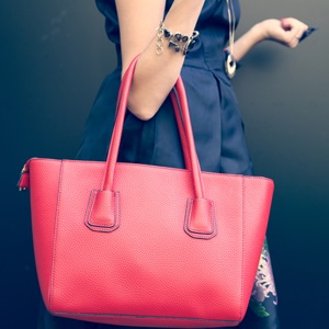 Handbags can contain things that are dangerous to children. 