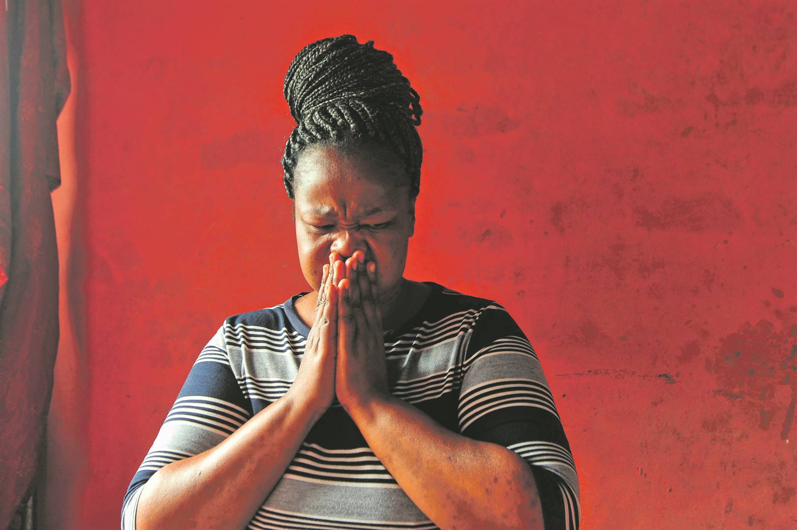 Tears stream down Charmaine Mhlongo’s face as she shares the ordeal of losing her son, Sanele Mngomezulu, in Phoenix last year Photo Rosetta Msimango