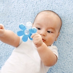 Baby with teether – iStock