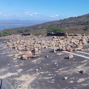 The Ubombo road blocked off with stones.  (Supplied)