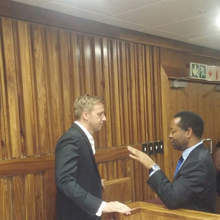 <p>Gareth Cliff shares a word with his legal team ahead of proceedings. </p><p></p>