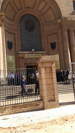 <p>We're at the High Court in Johannesburg. There's a small group of media outside. </p><p></p>