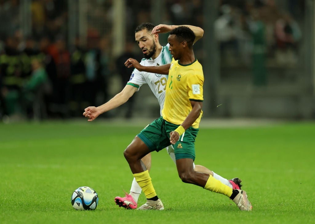 Nabil Bentaleb of Algeria and Themba Zwane of South Africa compete for the ball during the FIFA Series 2024 at the Nelson Mandela Stadium on 26 March 2024 in Algiers, Algeria. (Richard Pelham/FIFA via Getty Images)