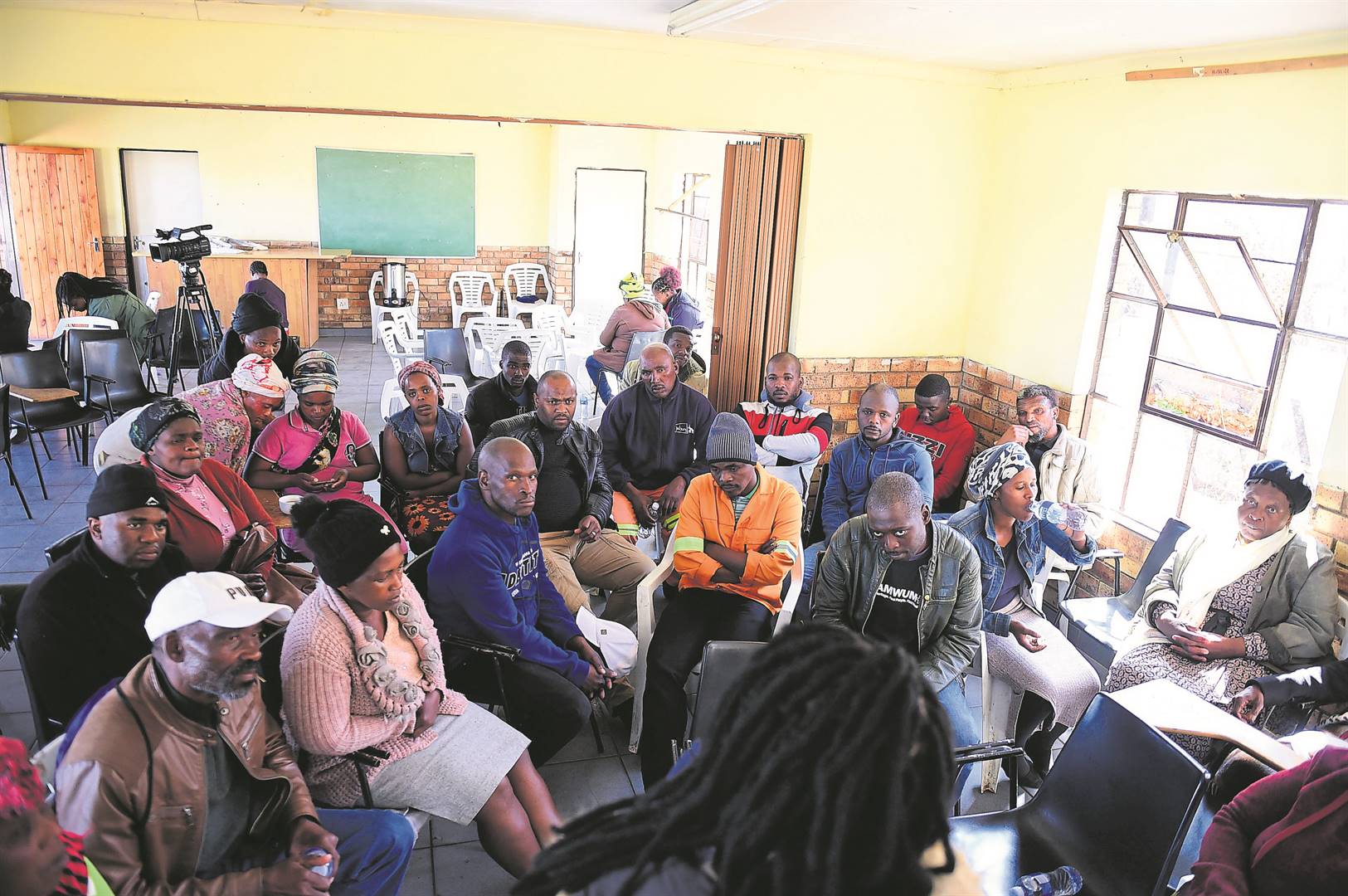 Families of the tavern victims attended a prayer session at a community hall in Soweto.     Photo by Christopher Moagi