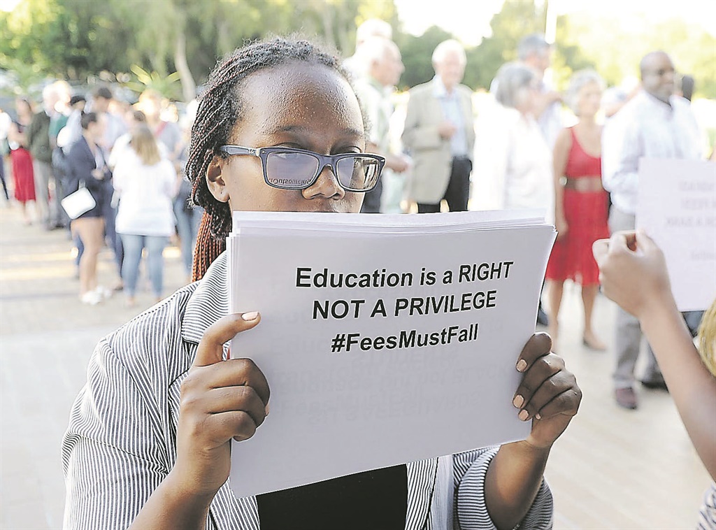 Students belonging to the #FeesMustFall movement protest at the convocation event. Picture: Nasief Manie 