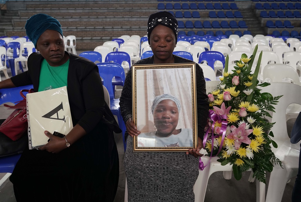 Family mourning loss of little girl at funeral