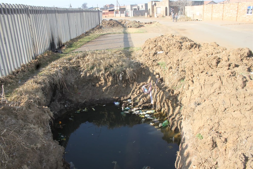 A hole left open by municipal workers. Photo by Phineas Khoza