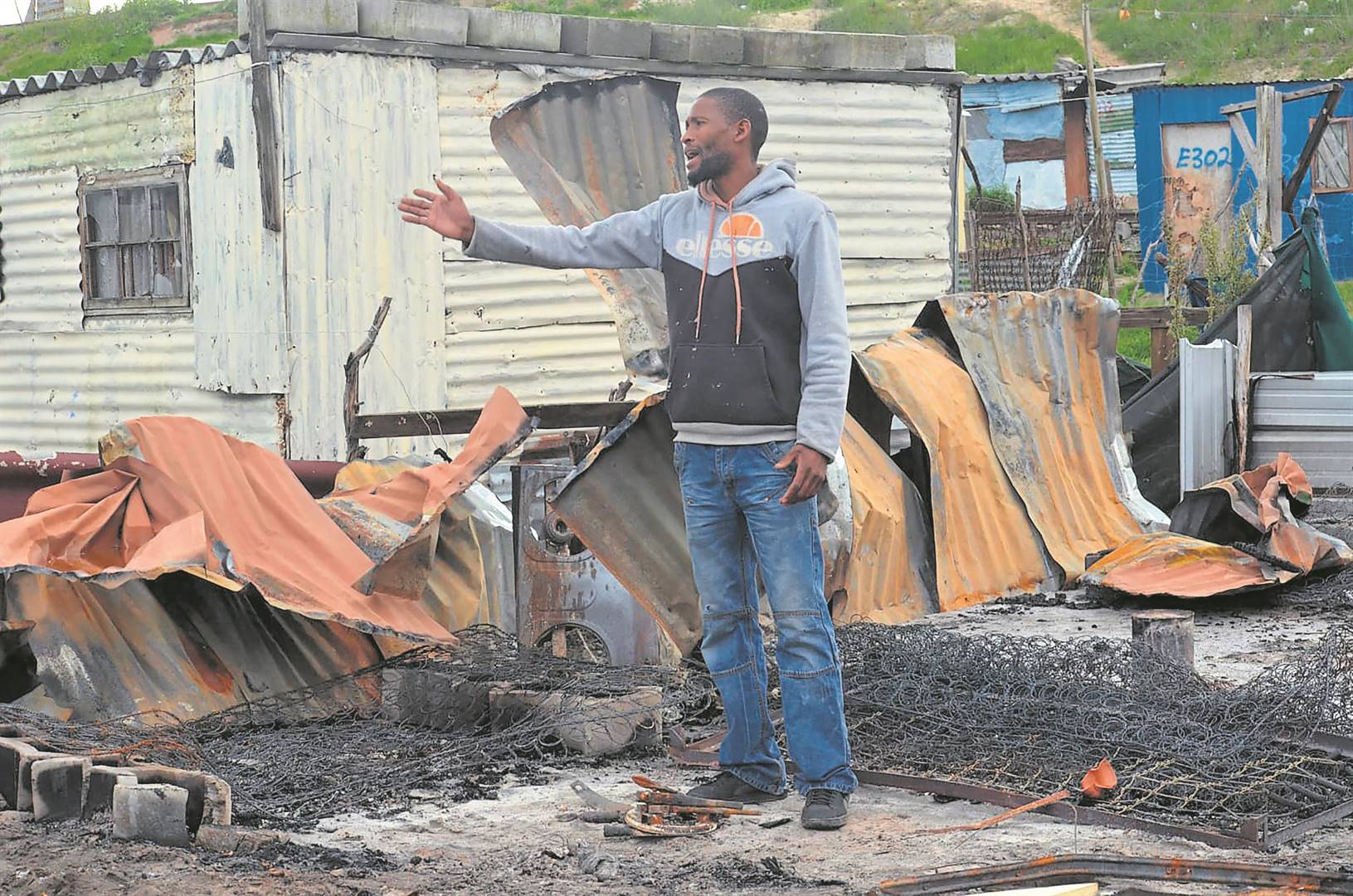 Thembalomzi Tyekana said the community of Vosho squatter camp burnt his shack while he and his children were asleep.   Photo by Lulekwa Mbadamane