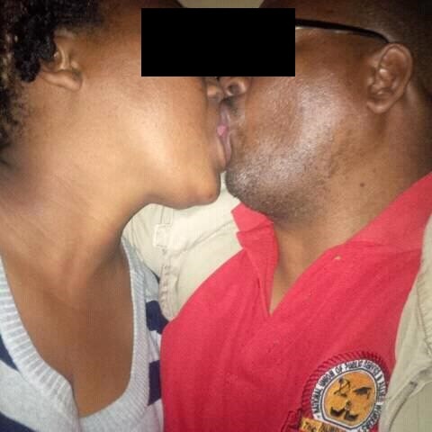 This picture shows the Reverend kissing the wife of another. Photo by Facebook