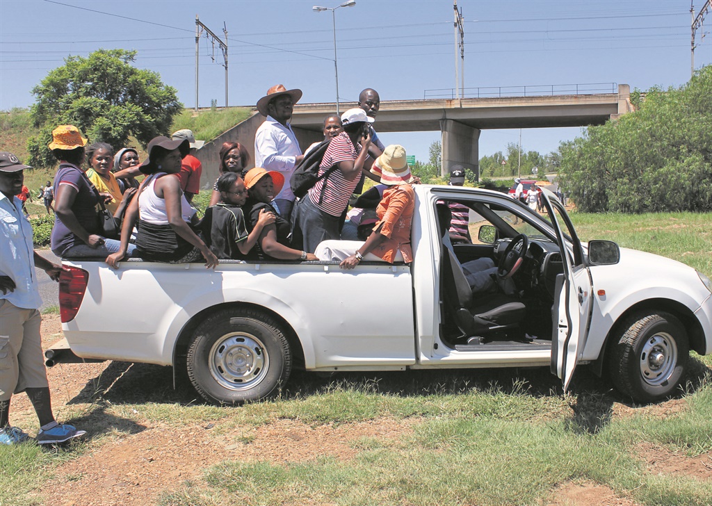 Protesters caught a lift home after cops dispersed them during an outsourcing protest at TUT’s main campus.             Photo by Andrew Mkhondo 