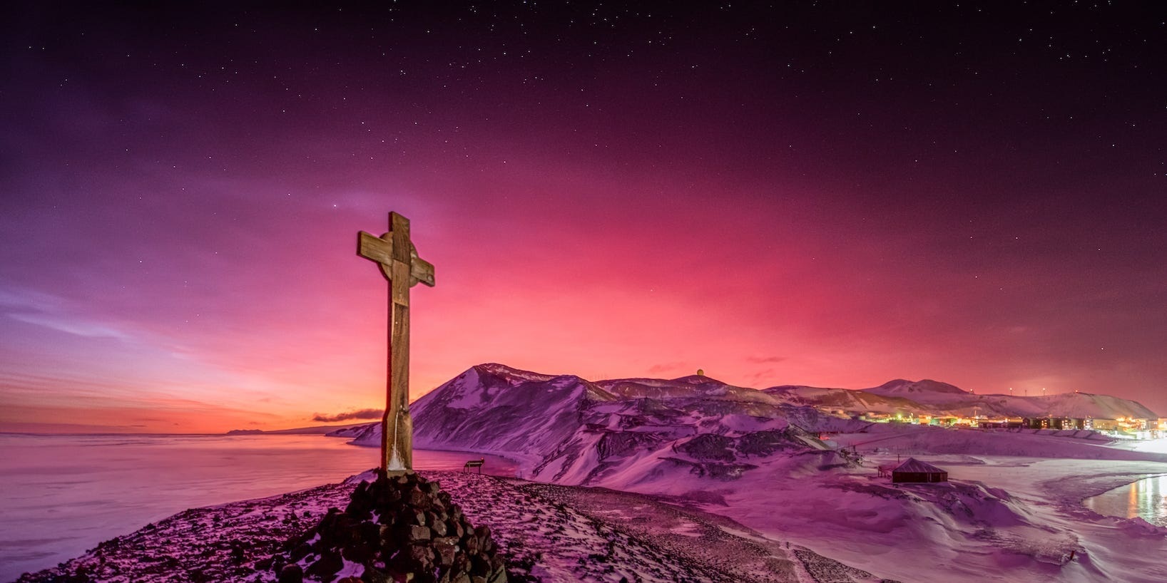 The picture shows Vince's cross on Hut point, erected in remembrance of George Vince, the first person known to have died in Antarctica. Stuart Shaw/Fly on the Wall Images