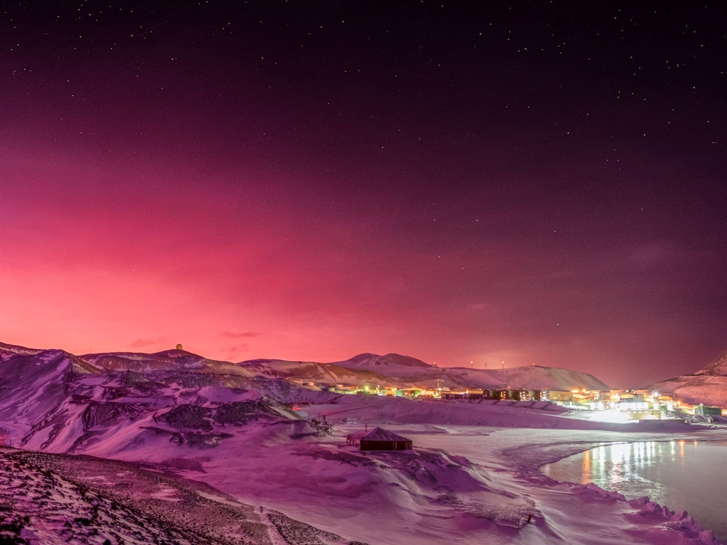 Aerosols from the January Tongan eruption likely turned the sky pink in Antarctica. This photo shows the Scott station.