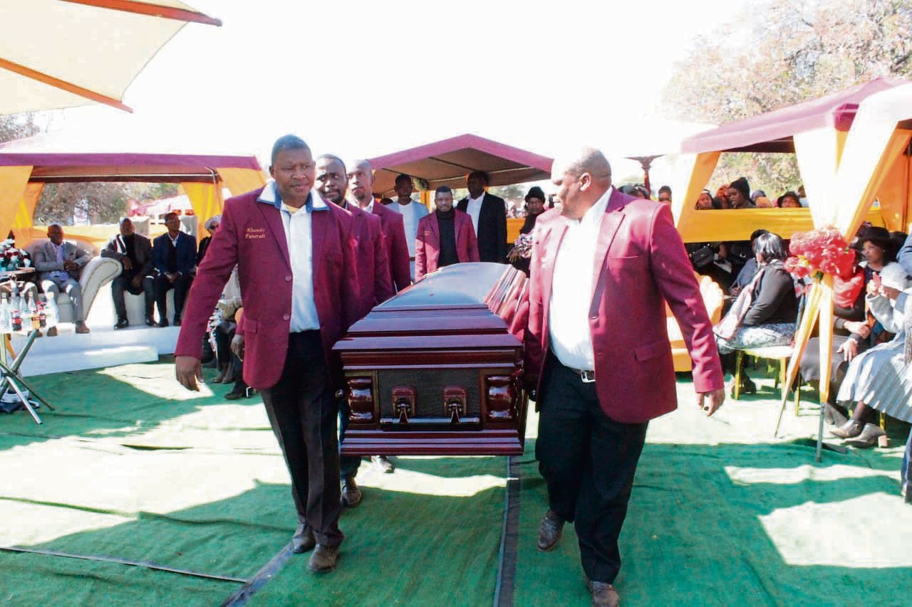Pallbearers carry the coffin of Tshepang Pitse to its final resting place at Moruleng cemetery at the weekend.            Photo by Aaron Dube