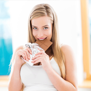 Pregnant woman enjoying chocolate