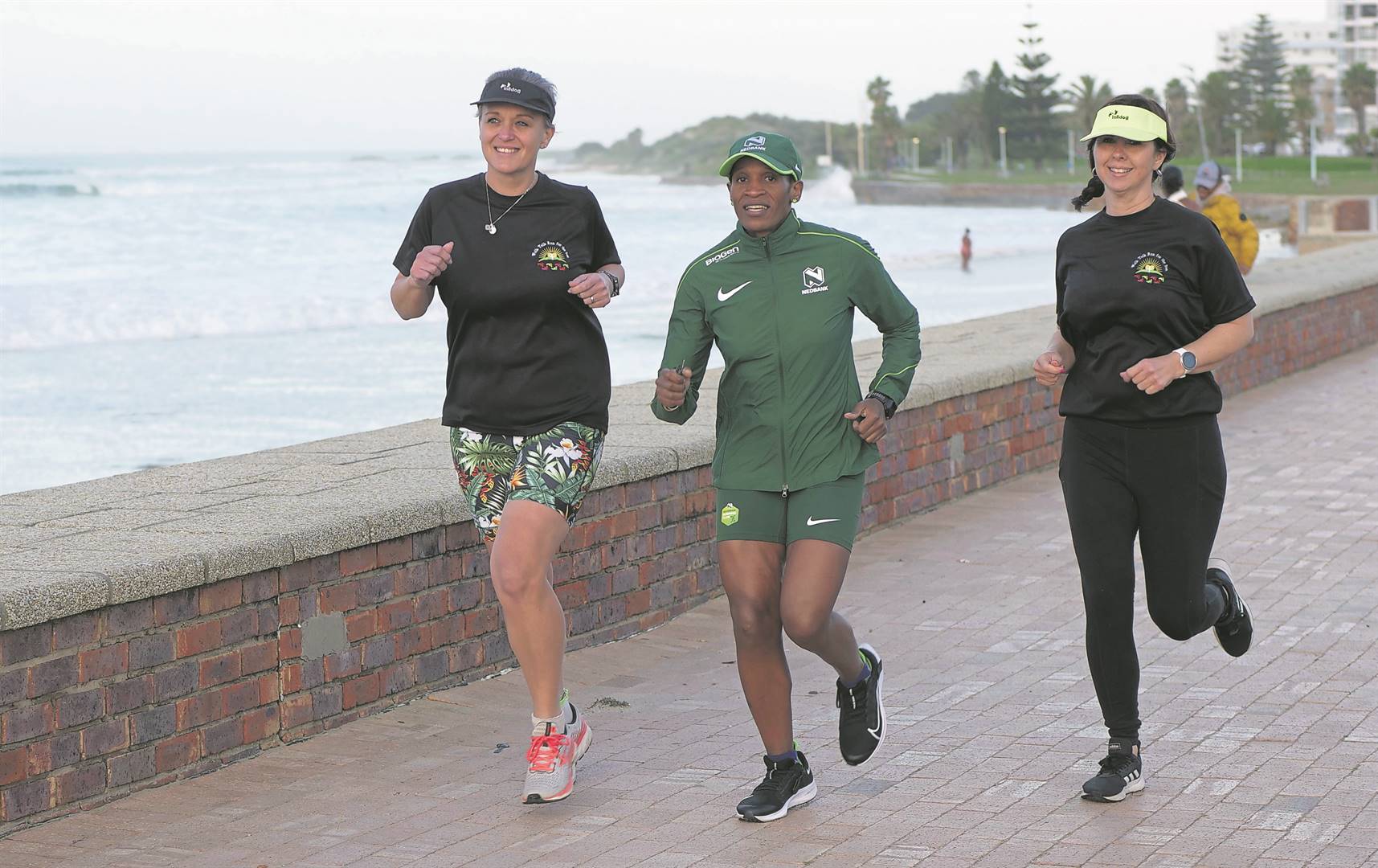 Well-known top local runner, Ntombesintu Mfunzi, is inviting all women to join her for the Choose to Challenge 10km on Saturday, August 6, starting from Kings Beach. Enjoying a social run are Bernadette Loock, Ntombesintu Mfunzi and Noreen Human.                                       Photo: UnderAfricanSkys Productions