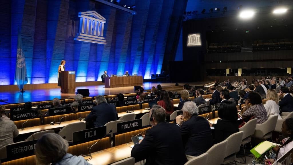 Unesco Director-General Audrey Azoulay (L) delivers a speech to announce the United States' request to return to the institution, at the Unesco headquarters in Paris.
