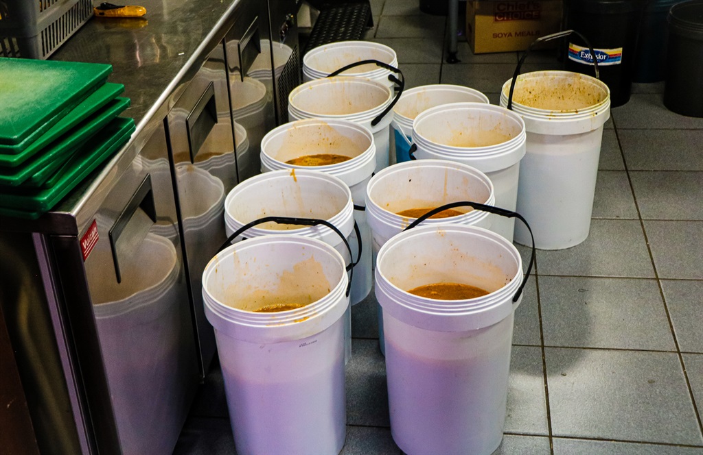 Buckets filled with freshly cooked nutritional soup by Chefs with compassion at the HTA School of Culinary Art .