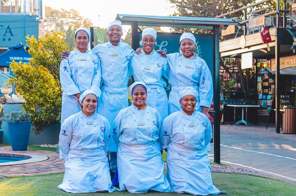 Culinary students who were being facilitated in the kitchen by Chef Dasen Suragaser from the Garden Court in Sandton pose for picture after a productive day. 
