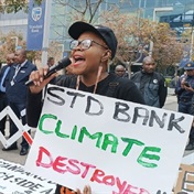 Activists forcibly removed as Standard Bank chair defends oil and gas finance