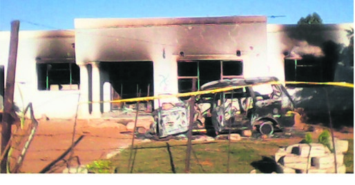 Angry residents allegedly burnt the house where the party was held.                                   Photo by Bongani Mthimunye 