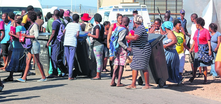 Residents were chased away by cops after preparing to storm a supermarket in KwaNobuhle.     Photo by    Thamsanqa       Mbovane