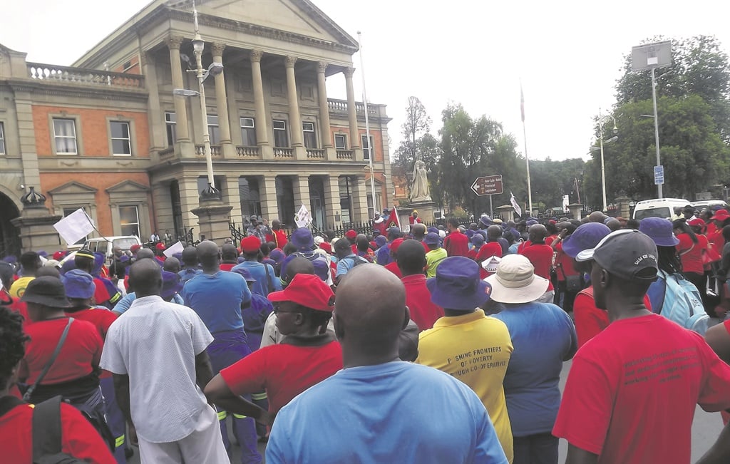 PHOTO: NQOBILE MTOLO The South African Municipal Workers Union members (red T-shirts) outside the KZN Legislature building after marching against the exploitation of contract workers in the local municipalities.  
