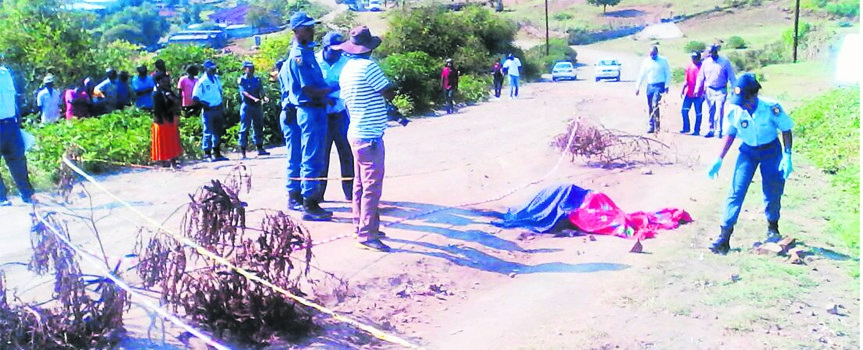 Residents and police at the scene where a 59-year-old man was burnt to ashes by unknown suspects. Photo by SAPS