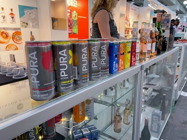 PURA stall and beverages at a showcase in the USA 